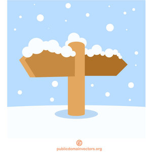Wooden sign covered with snow